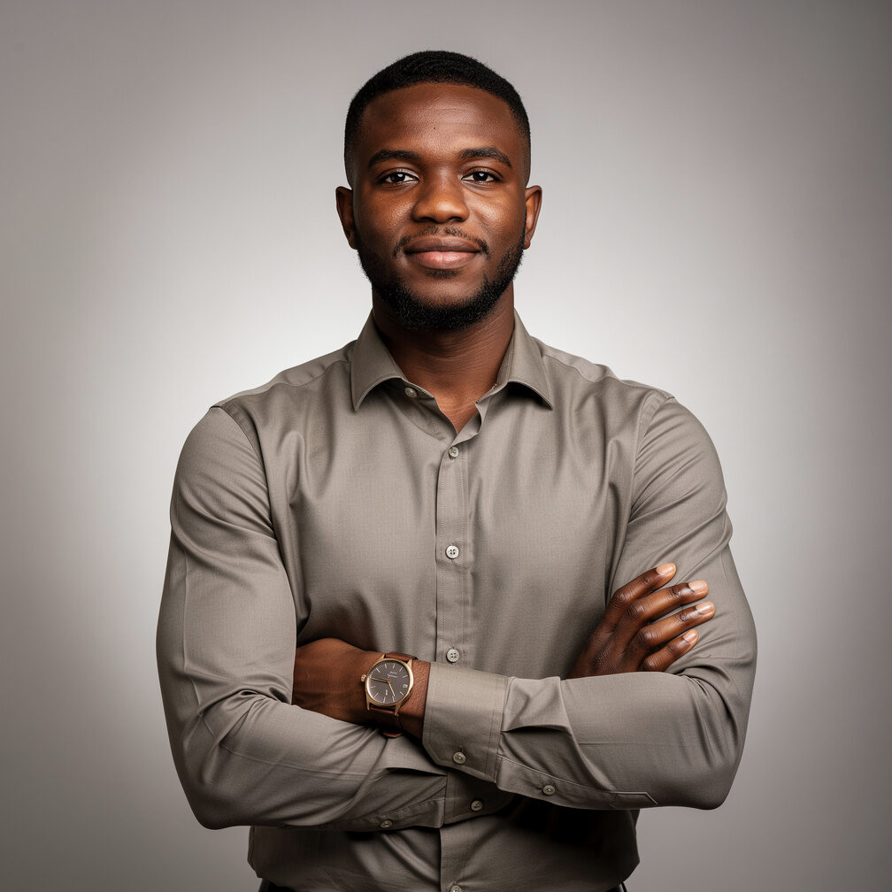 Broadcast engineer, a Black British man in his 30s in smart casual attire