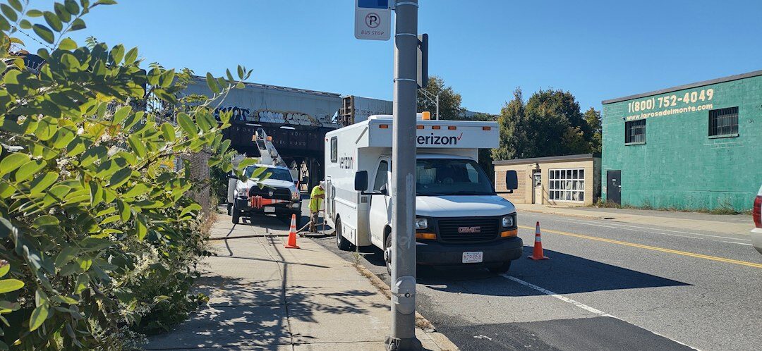 Outside broadcast van with satellite dish and cables during a live event
